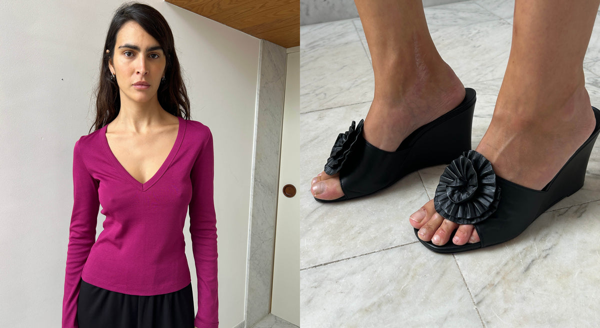 Fuchsia V-neck long-sleeve top and black wedge sandals with a leather flower